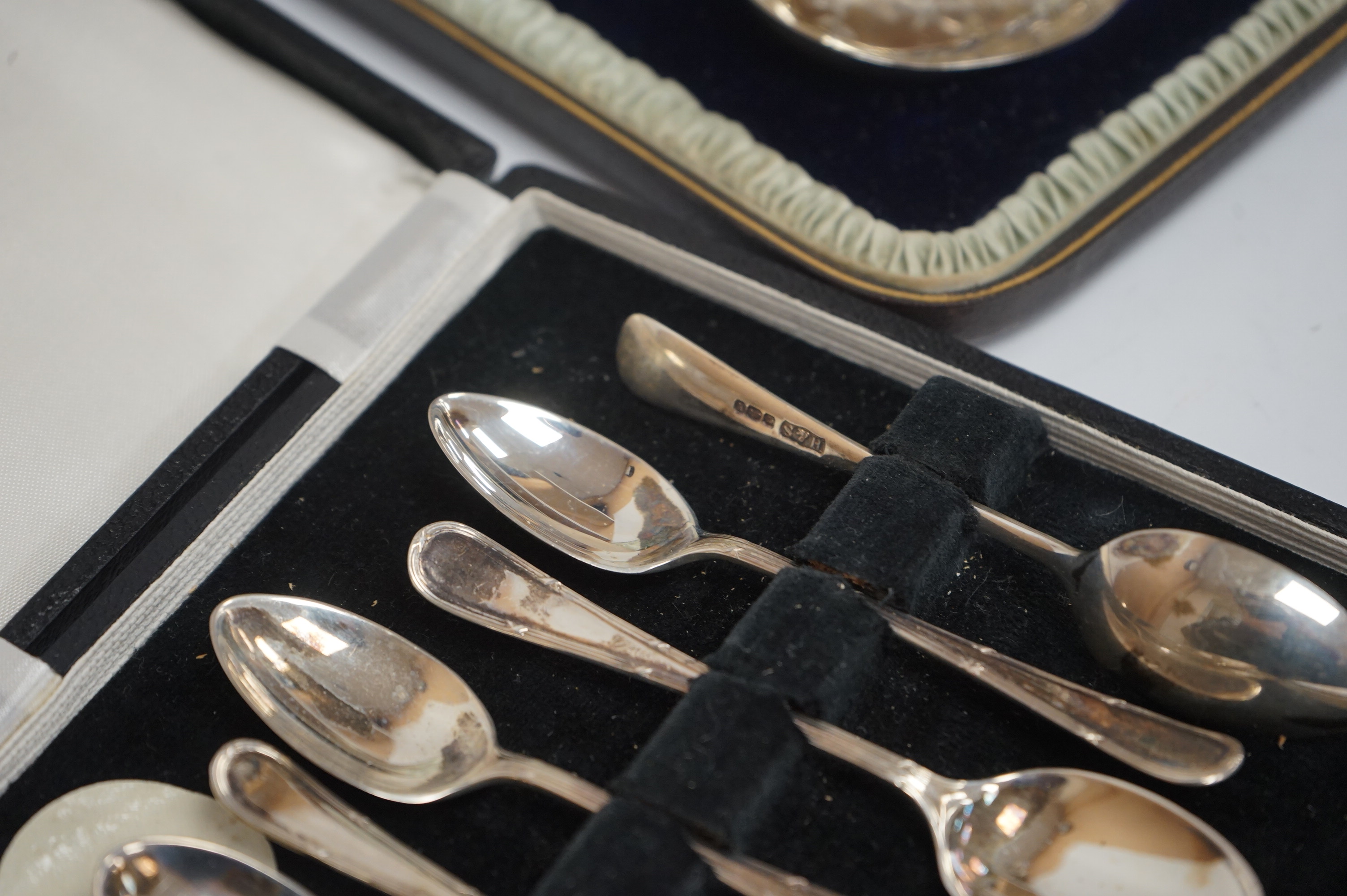 A cased pair of Victorian silver serving spoons and matching sifter spoon with engraved floral decoration, Atkin Brothers, Sheffield, 1888, together with a cased set of six late Victorian silver coffee spoons and matchin